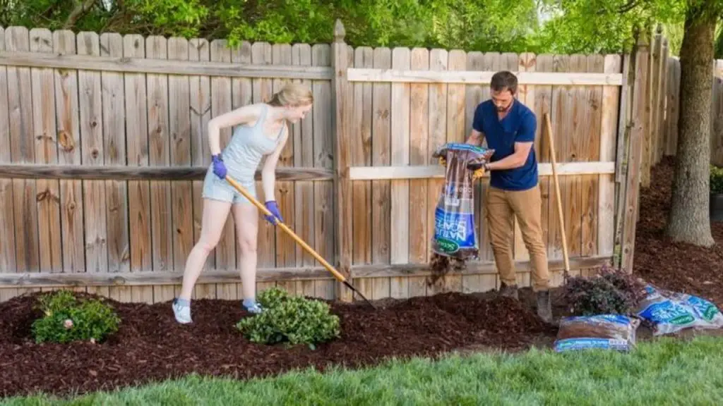 throwing mulch in the lawn